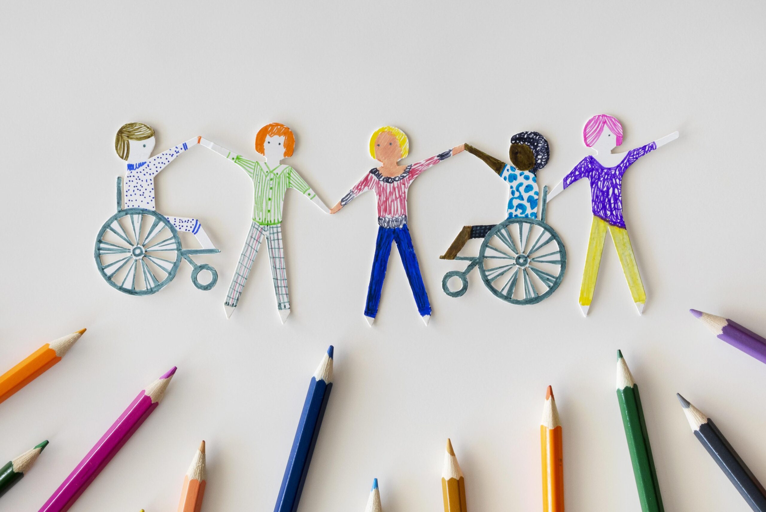 Home multi ethnic disabled people community with pencils